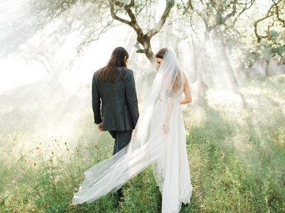 boho bride and groom in forest