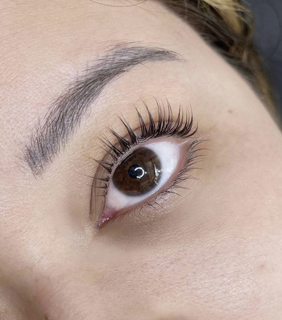 A photo of a client's eyes after undergoing our professional lash extension service at Wilde Beauty Co. in San Diego, showcasing the dramatic and captivating effect that the longer and fuller lashes have on the overall appearance.