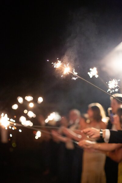 guests hold sparklers for wedding exit near Chicago