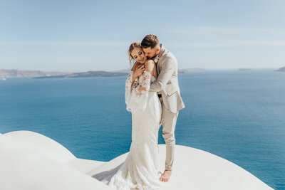 couple embracing front of Aegean Sea
