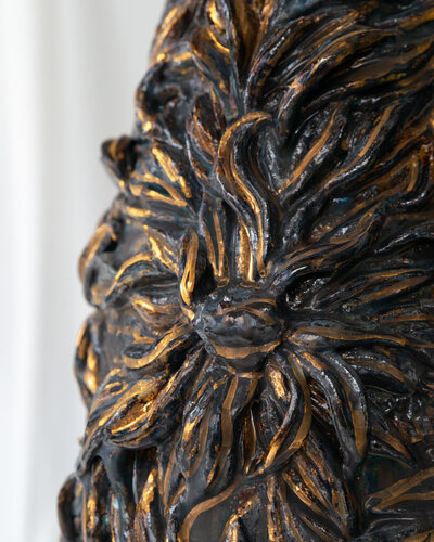 Product photography showcasing a collection of Gerda Satunas' European-inspired ceramic sculptures, highlighting texture and detail