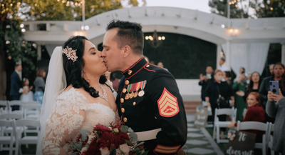 Young couple kissing after wedding ceremony at Noriega House in Bakersfield, California.