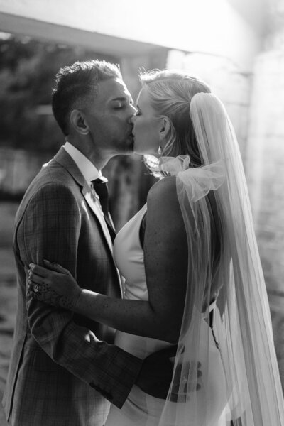 Bride and Groom kiss during their Brisbane wedding at the Powerhouse - Brisbane wedding photographer