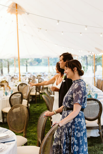 The couple stands alongside their wedding planner, taking in the magic of the room reveal—a shared moment of awe, gratitude, and dreams beautifully brought to life