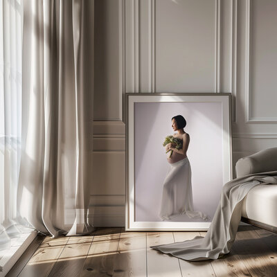 framed maternity image of mother holding flowers