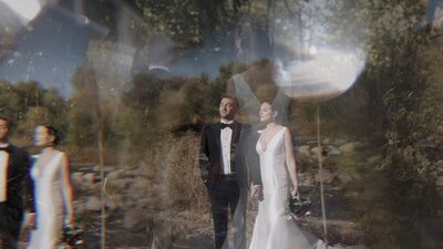 bride and groom standing in grass