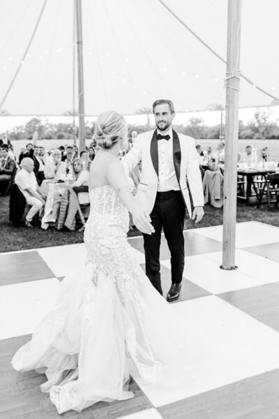 Bride & Groom sharing first dance  under sailcloth tent at agapae oaks