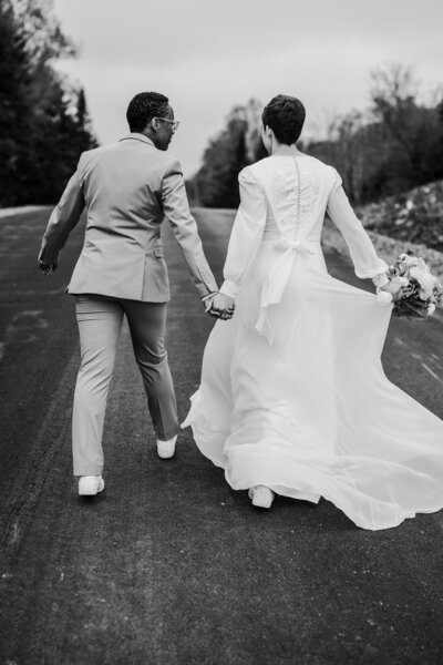 Same sex couple enjoying a stroll after their I Do's