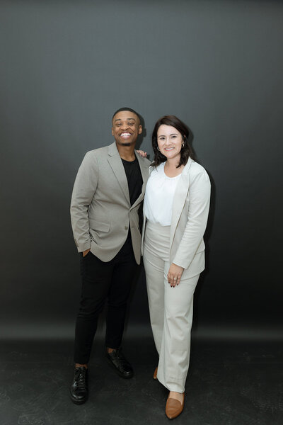 woman and man smiling at the camera