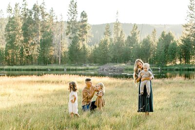 Family in a field in Yellowstone National Park
