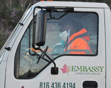 Embassy employee in a work truck