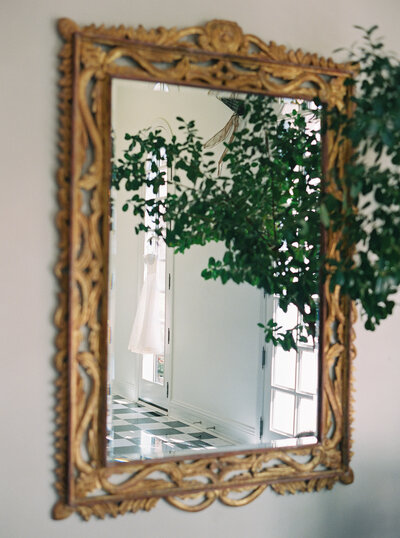 Fine art wedding photography capturing elegant wedding details, featuring a gold mirror reflection at a high-end Scottsdale resort wedding.