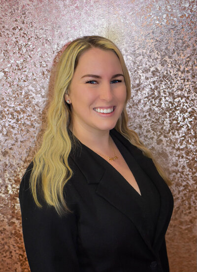 Blonde woman profile picture on a sparkly background