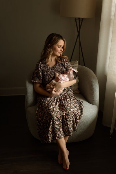 Mom holding her newborn in her arms