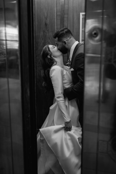 Creative photo of a bride and groom in an elevator