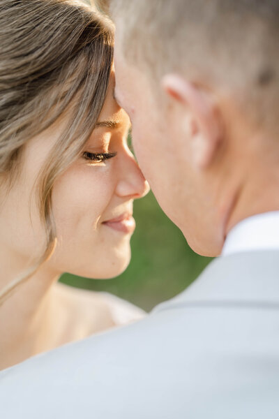 Wedding couple standing in Manitoba, Canada garden