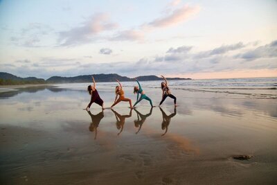Students practicing on a beach in Costa Rica during a Soma Yoga Institute teacher training retreat.