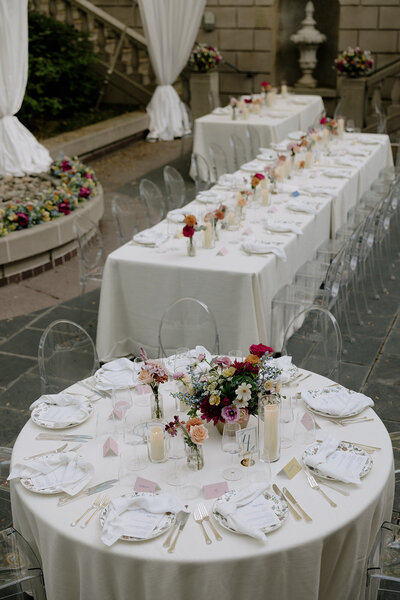 white wedding tables with clear chairs