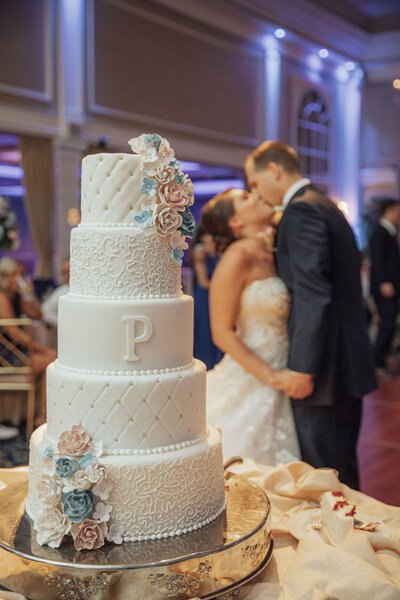 The Palace at Somerset Park | Wedding couple kissing after cake cutting | Somerset, New Jersey