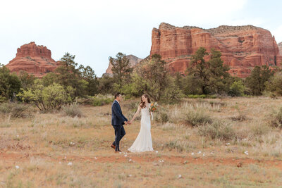 bride and groom walking in Sedona