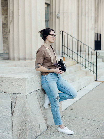 One of the top photographers in baltimore, Nicole Simensky, looking at albums