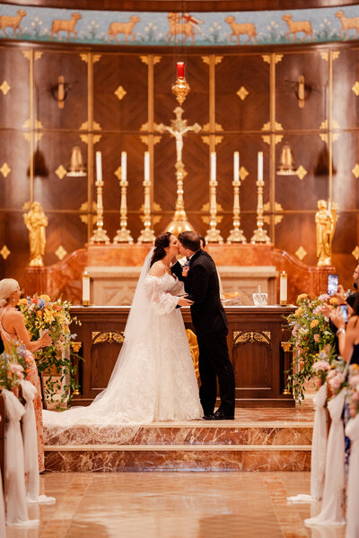 the first kiss between a bride and groom on their wedding day