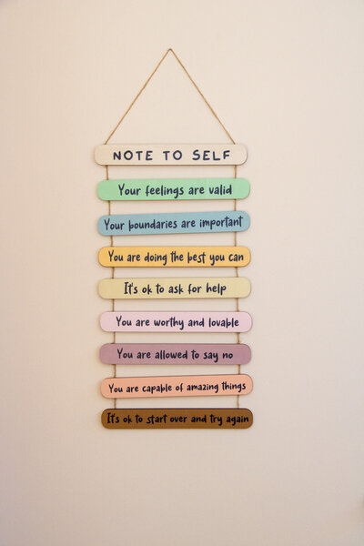 Image of hanging wall art featuring encouraging quotes. Are you feeling discouraged and overwhelmed? Discover the hope and healing possible through virtual Christian therapy in Gilbert, AZ.