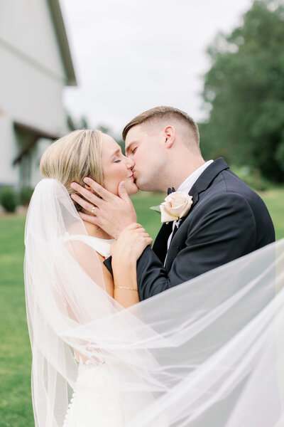 Bride and groom kissing