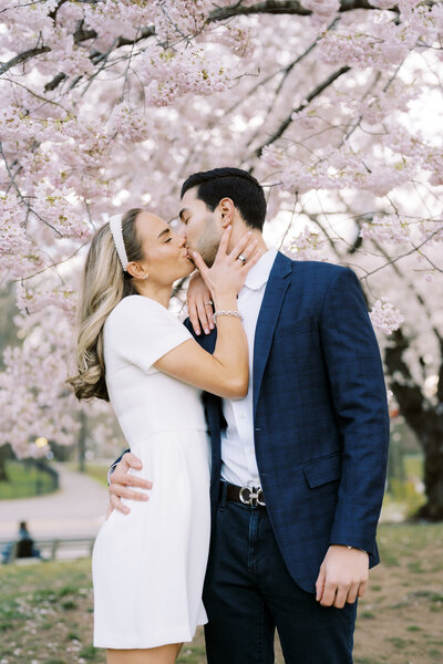 Couple in front of plane at TWA Hotel