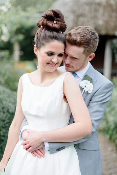 bride and groom smiling