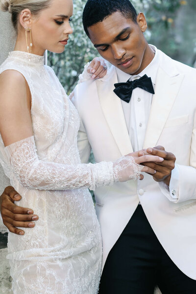 luxury wedding photo of bride and groom holding hands