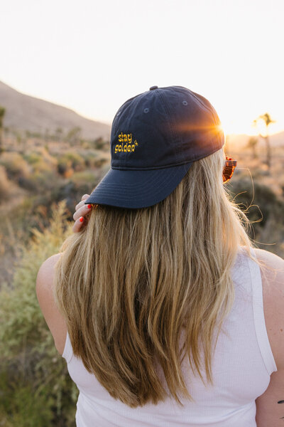 "stay golden" organic dat hat, golden hour club hat in joshua tree during golden hour