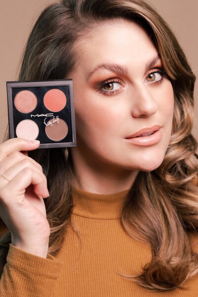 Commercial beauty photography for MAC Cosmetics collaboration with influencer holding custom eyeshadow palette