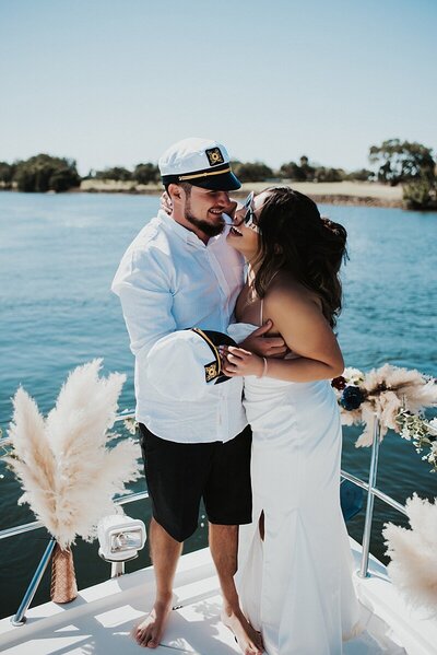 Bride and groom sharing a kiss and a dirty martini at the Tini Martini Bar in Saint Augustine after their intimate wedding during Night of Lights
