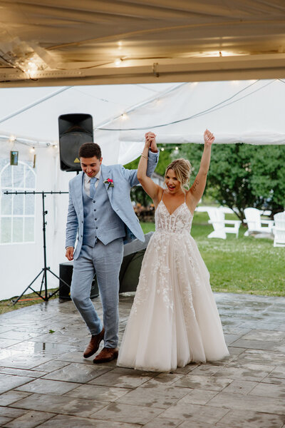 Newly married couple making their entrance at their reception
