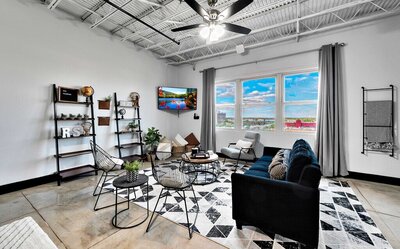 Industrial modern vibes in this studio vacation rental condo in the historic Behrens building with a 5th floor view of downtown Waco, TX
