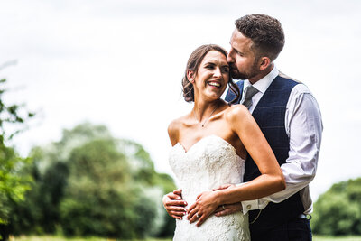 Bride and groom first look photos in field