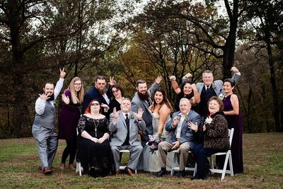 Fun family photo of bride and grooms family together