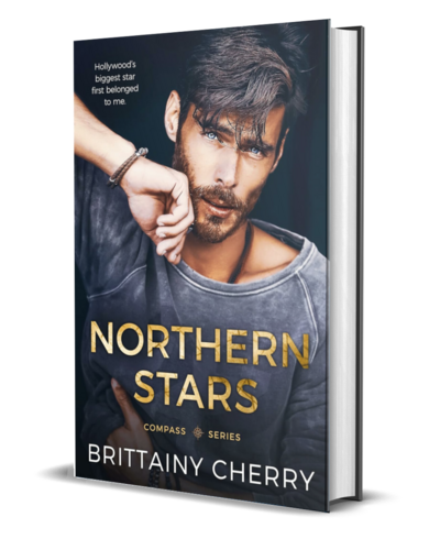 man with beard wearing a white shirt looks down on the cover of the air he breathes by romance author brittainy cherry