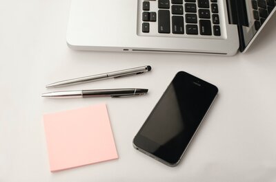 computer and iphone on desk