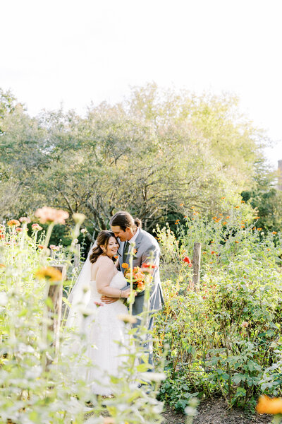 Bride and Groom smiling in the fields