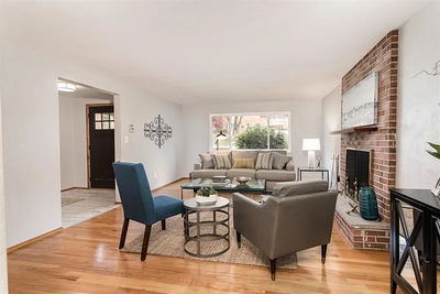 Minimalist staging in a bedroom to highlight natural light and room dimensions
