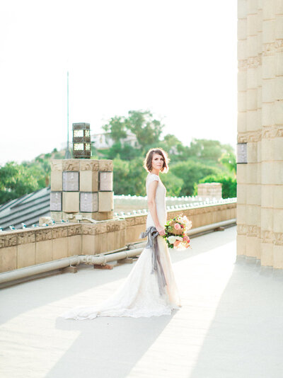 Elegant outdoor reception setup at the Arizona Biltmore with chandeliers, greenery, and long banquet tables, photographed in editorial fine art wedding style.