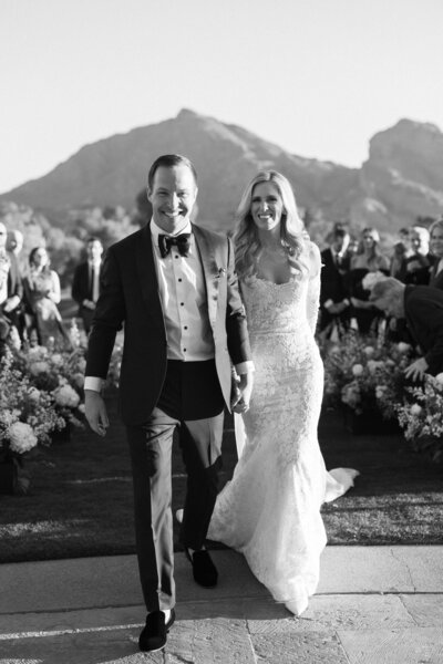 Bride and groom walking out of ceremony at Paradise Valley Country Club in Arizona