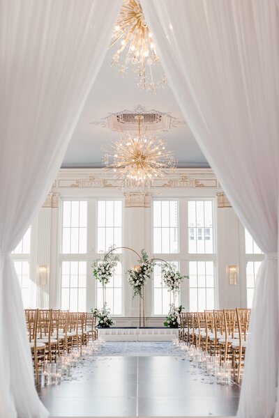 Wedding ceremony space with white drapery