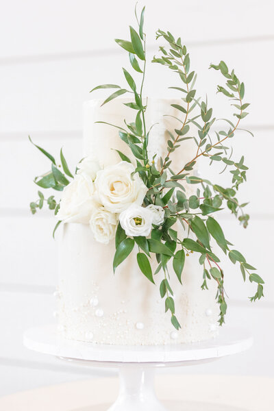 bright light and airy wedding photo of cake