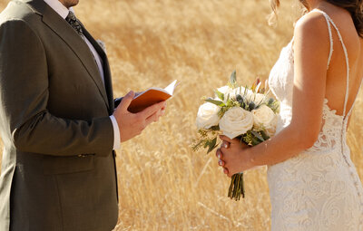  Bride reading wedding vows during intimate Oregon elopement