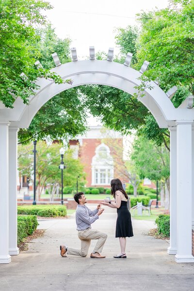 Surprise proposal in the breezeway at Courthouse Square | Opelika AL Photographer Amanda Horne