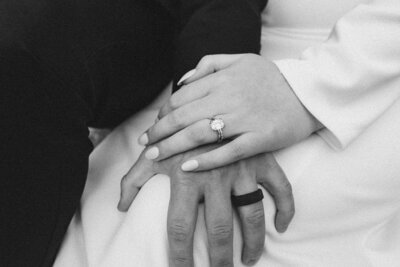 closeup of bride and groom wearing their wedding rings