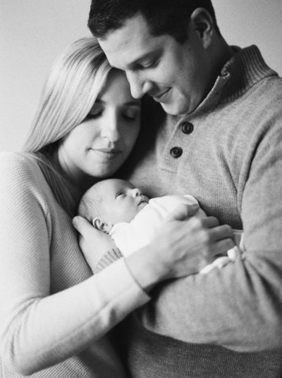 black and white formal maternity session in a falmouth maine field by carrie pellerin